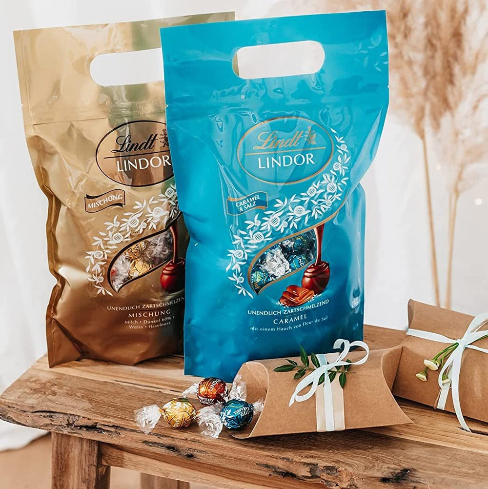 Bile de ciocolată LINDOR cu caramel sărat | aprox. 80 de bile de ciocolată cu lapte cu umplutură de caramel sărat | Pachet vrac & Bile de ciocolată Marc de Champagne | 700 g