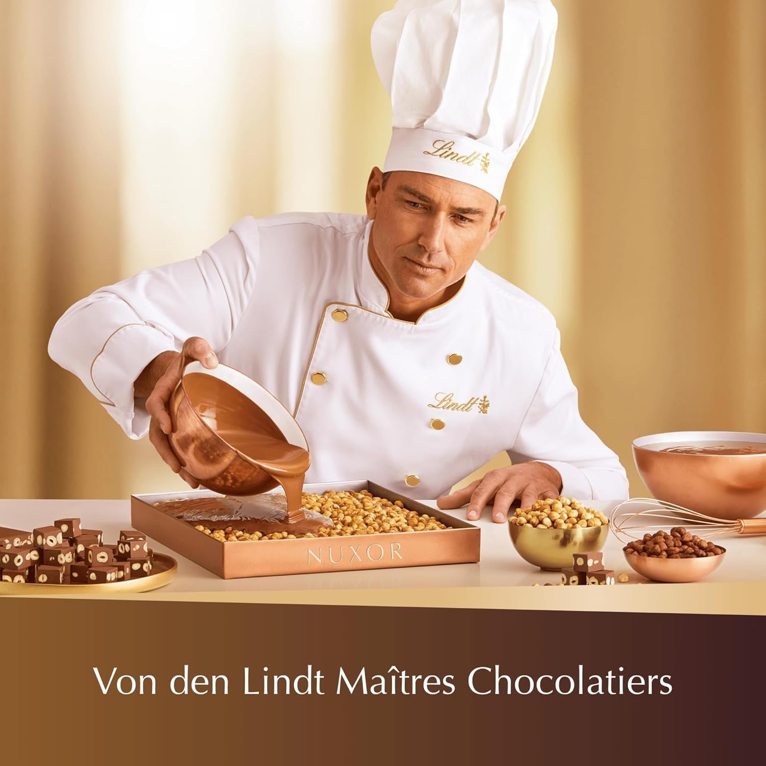 Ciocolată Lindt NUXOR alba cremoasă cu alune prăjite întregi, 103 grame Naty Shop