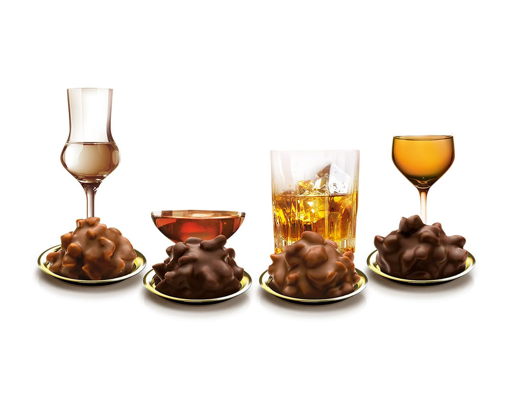 Picături fine în nuci clasice Brandies 250g, praline de ciocolată umplute cu lichid, cu glazură de ciocolată cu lapte și bucăți crocante de alune de pădure